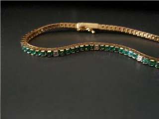 18k yellow gold kelly green emerald and diamond tennis bracelet