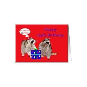 69th Birthday, raccoons stealing a present Card