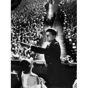 President John Kennedy Next to His Wife Jacqueline Overlooking Crowd 
