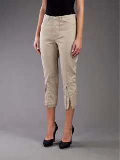  cotton cropped trousers featuring an eyelet edges slit to the shins 